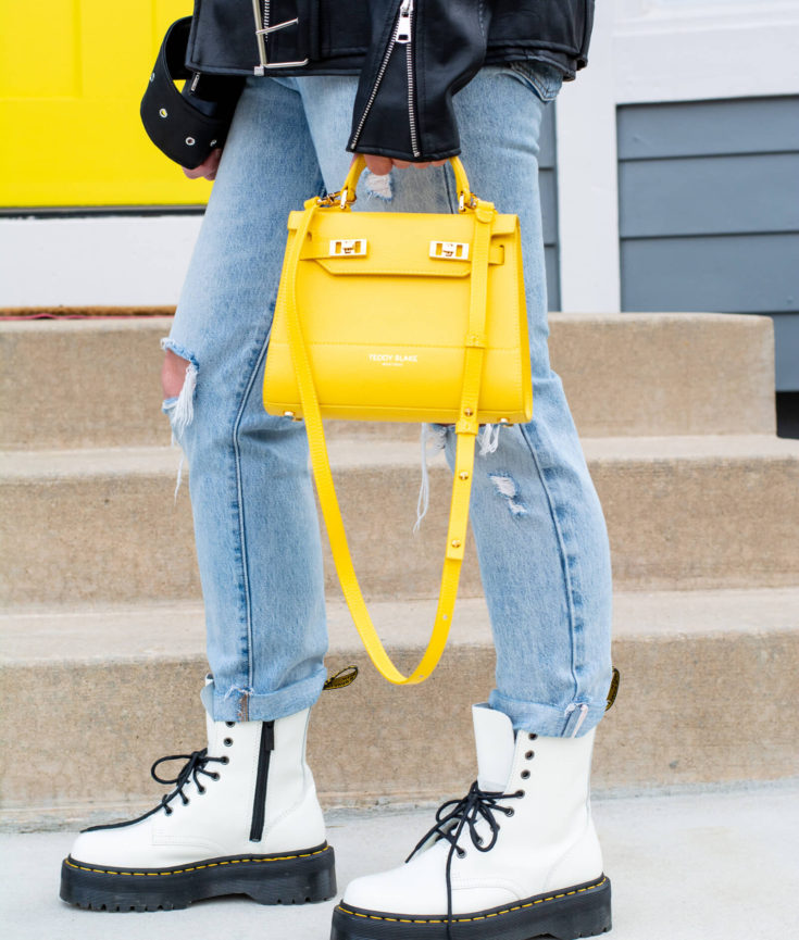 Oversized Moto Jacket with White Doc Boots + Yellow Teddy Blake Bag.