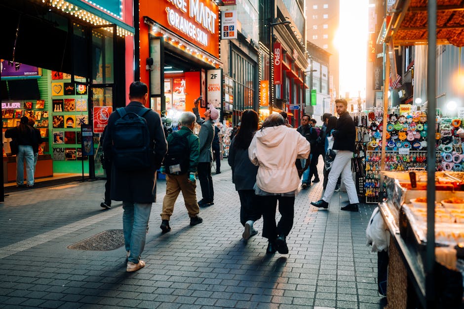Explore a bustling street market in Seoul, filled with colorful stalls and diverse people.