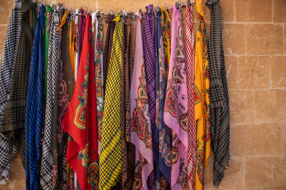 Vibrant traditional Turkish scarves hanging on a wall in Midyat, Mardin.